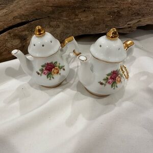Royal Albert Old Country Roses teapot-shaped salt and pepper shakers.